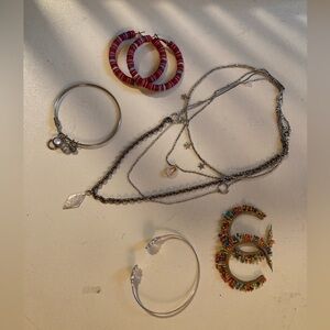 Free People jewelry layering necklace bracelets and bright hoop earrings